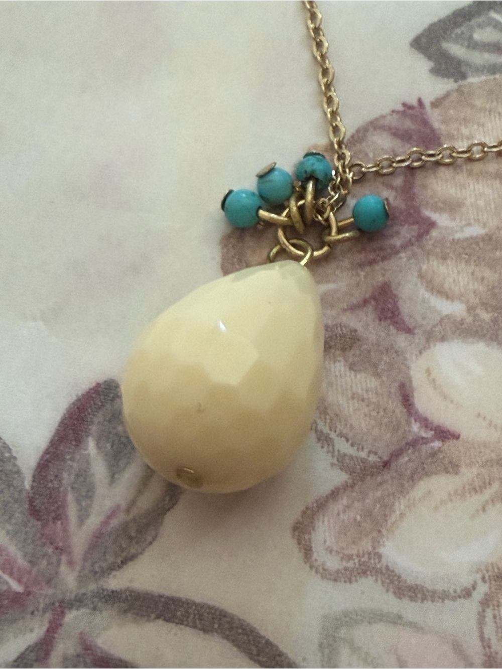 Gold-Tone Necklace with Cream Teardrop Pendant and Turquoise Accent Beads